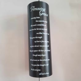 Black hanging memorial plaque with white "Amazing Grace" text