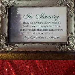Framed memorial plaque with an "In Memory" message