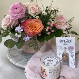 Pink and peach rose bouquet in a blush vase with a candle and diffuser gift set