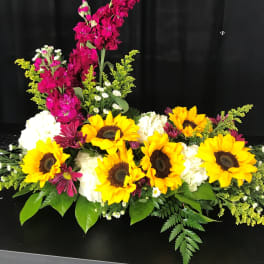 Bright sunflower arrangement with white blooms and magenta flowers