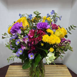Colorful mixed bouquet in a clear glass vase