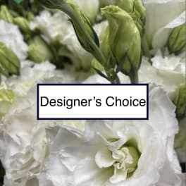 White lisianthus blooms with green buds and a Designer's Choice label