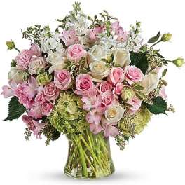 Pink and white mixed flower bouquet in a glass vase