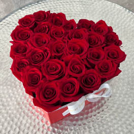 Heart-shaped box filled with red roses