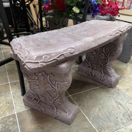 Decorative stone bench with vine carvings
