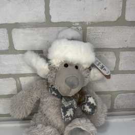 Plush gray teddy bear wearing a white hat and scarf