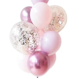Cluster of pink and clear confetti balloons on a white background