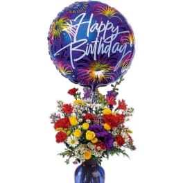 Tall mixed bouquet in a blue vase with a large Happy Birthday balloon.