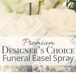 White funeral easel spray with large blooms and printed text