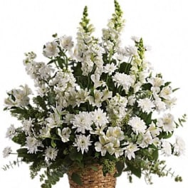 White floral arrangement in a woven basket