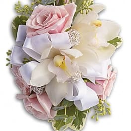 Pink roses and white orchids with a lavender ribbon