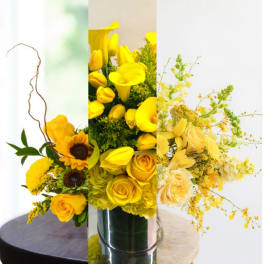 Yellow floral arrangement with roses, calla lilies, and sunflowers