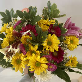 Bouquet of yellow daisies, pink gerberas, and lilies
