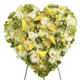 Heart-shaped floral spray with yellow and white flowers