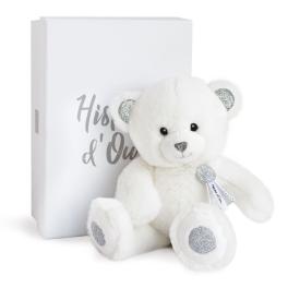 White teddy bear with silver accents beside a white gift box