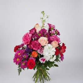 Mixed bouquet of pink, white, and red flowers