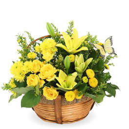 Yellow flowers arranged in a wicker basket with a butterfly decoration