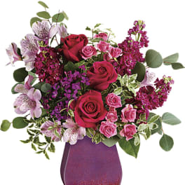 Pink and red rose bouquet in a glittery purple vase