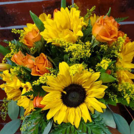 Bouquet of yellow sunflowers and orange roses