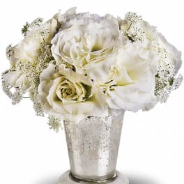 White roses in a silver vase