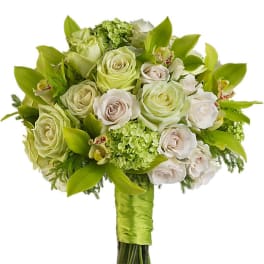 Green and white bouquet of roses and orchids with a satin-wrapped handle