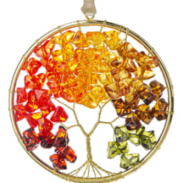 Circular hanging ornament with colorful glass pieces in a tree design