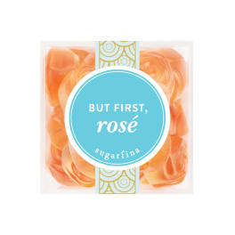 Box of orange rose-shaped candies labeled "But First, rosé"
