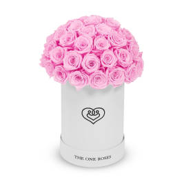 Pink roses arranged in a white cylindrical box