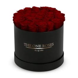 Red roses arranged in a black round box