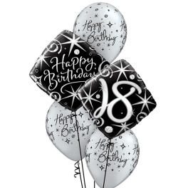 Cluster of black and white birthday balloons with "18" on one balloon