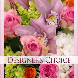 Pink roses and lavender orchids with white blooms and green filler