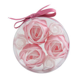 Round clear box with pink rose-shaped flowers and a pink ribbon bow