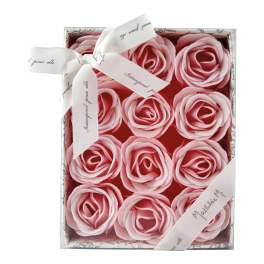 Box of pink rose-shaped soaps tied with a white ribbon
