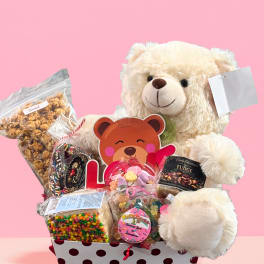 Teddy bear gift basket with assorted candy and snacks