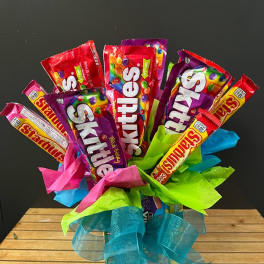 Bouquet of candy bars wrapped in bright tissue and ribbon