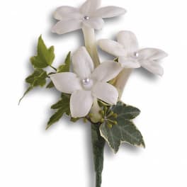 White flower boutonniere with ivy leaves