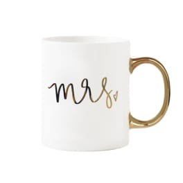 White mug with gold handle and "mrs" lettering