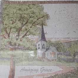 Framed painting of a church with a tall steeple and large tree