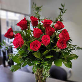 Premium dozen red roses in the vase
