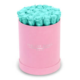Turquoise roses in a pink round box