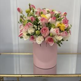 Pink and white rose bouquet in a pink cylindrical box