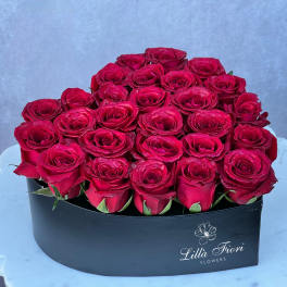 Heart-shaped box filled with red roses