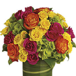 Bouquet of multicolored roses in a green glass vase