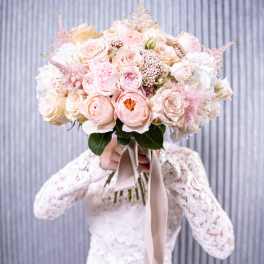 Large blush and ivory rose bouquet with a satin ribbon
