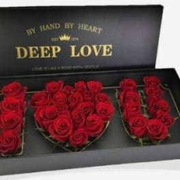 Red roses arranged in a black gift box spelling "DEEP LOVE"