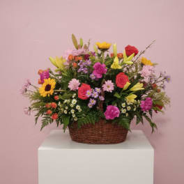 Mixed flower basket with roses, lilies, and daisies