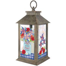 Wooden lantern with patriotic floral panels and a "My Home Sweet Home" sign