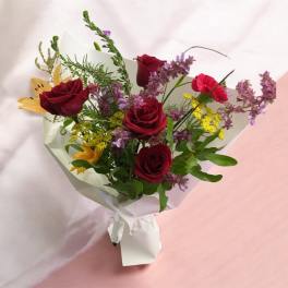 Red roses with seasonal bouquet