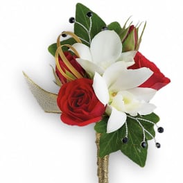 Red and white rose boutonniere with green leaves and gold ribbon
