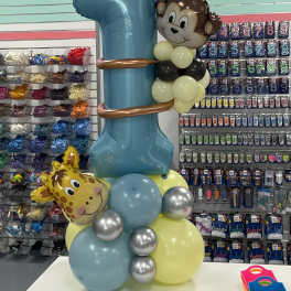 Balloon tower with a large blue number 1 and animal face balloons